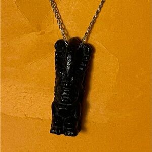 Tiki pendant on 22” silver chain